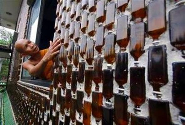 Buddhist temple built out of Heineken and Chang beer bottles