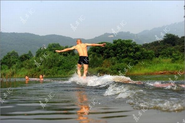 Gliding on Water (Qing Gong) Performed by Monk of South Shaolin Temple gliding on water by monk 15 in Gliding on Water (Qing Gong) Performed by Monk of South Shaolin Temple