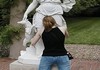 People Playing With Statues